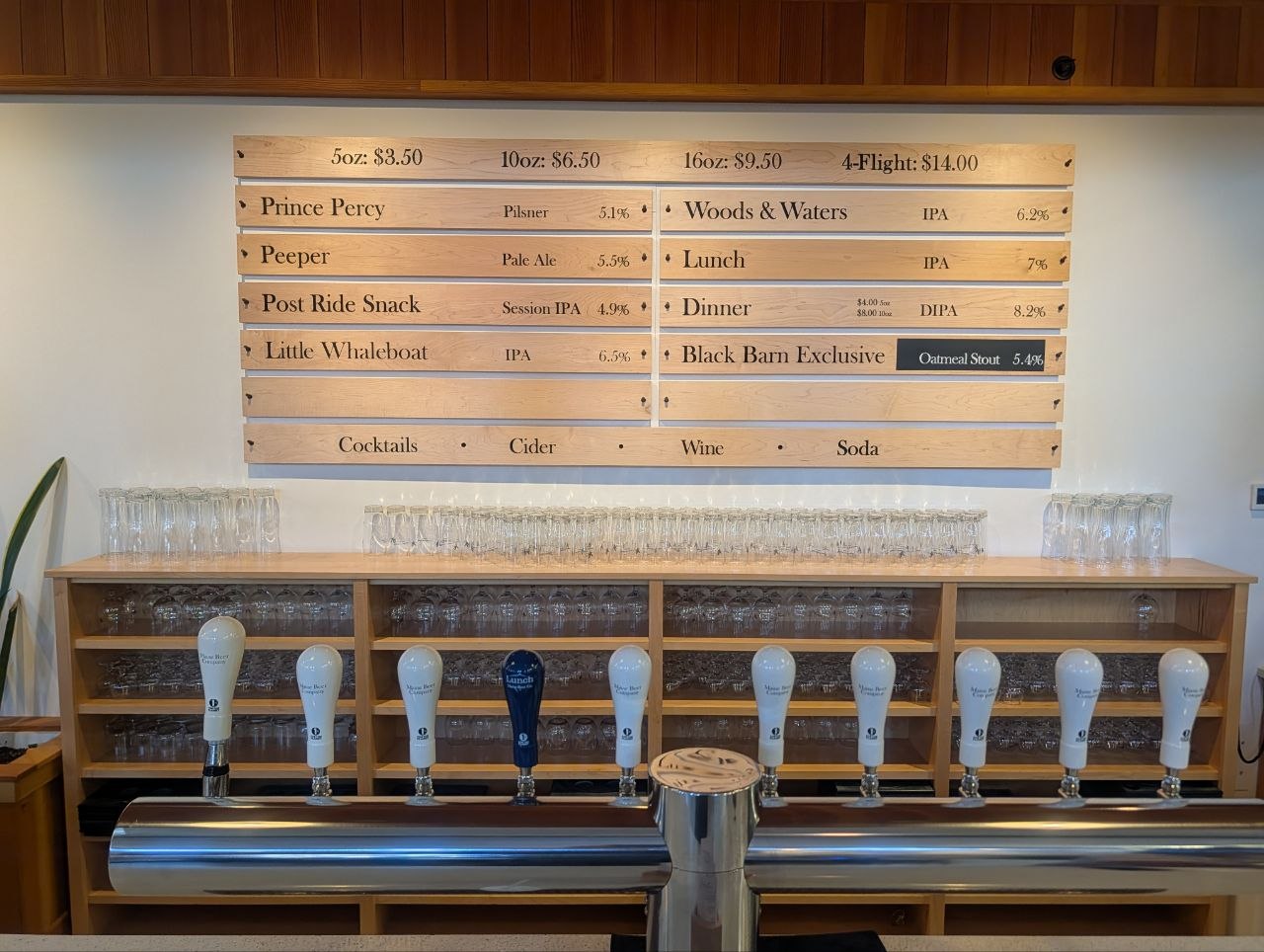 The wood tap board at Maine Beer Co, Freeport — eight house beers on draft