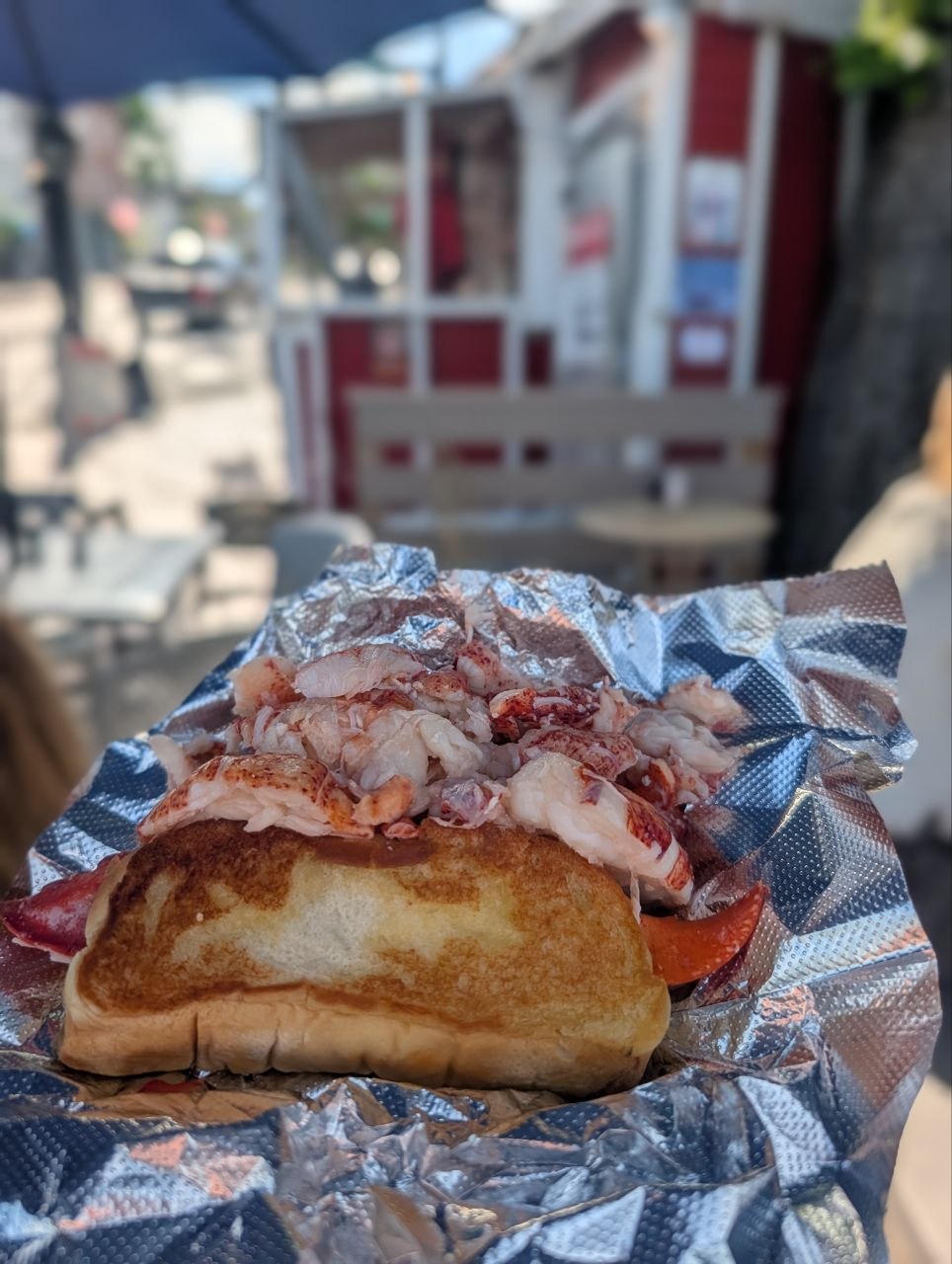 Red's Eats' legendary lobster roll — a full claw piled on an overflowing, butter-griddled bun