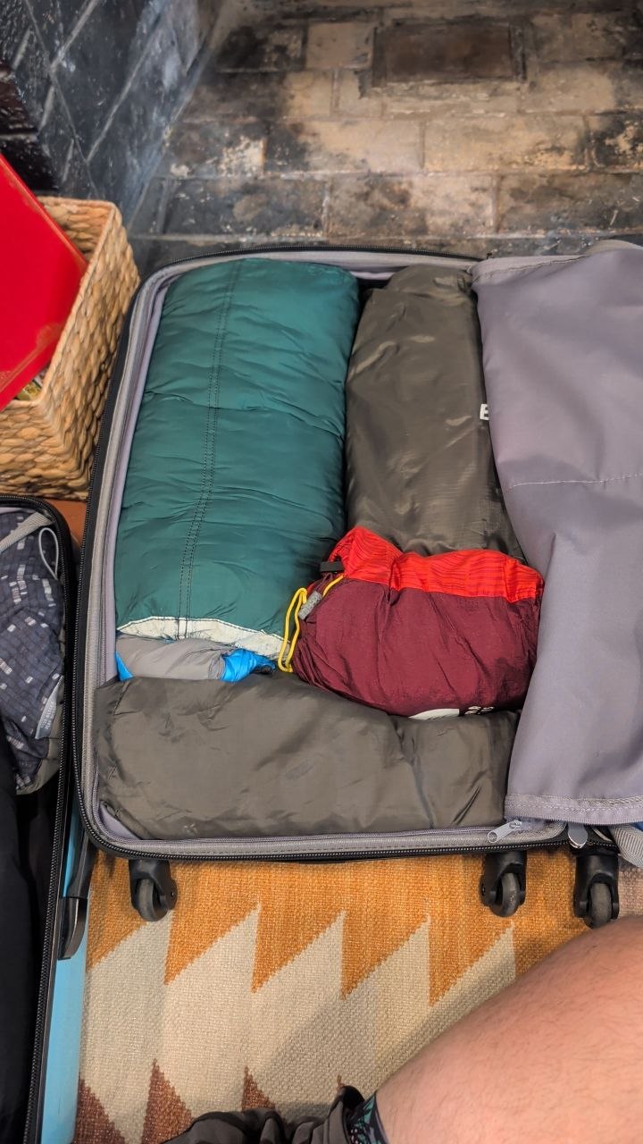 Second checked bag with sleeping bags and pads