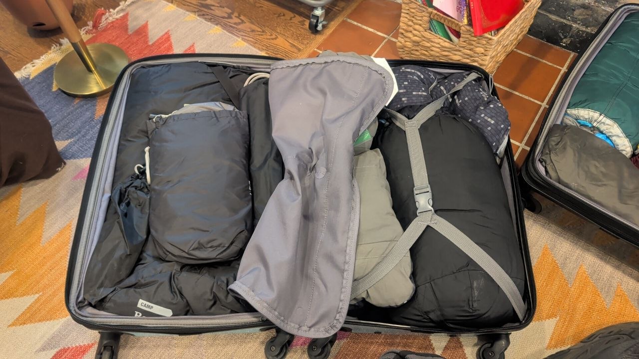 Checked bag with the tent system packed